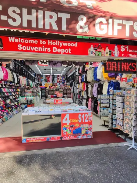 Souvenir racks spilling onto the sidewalk